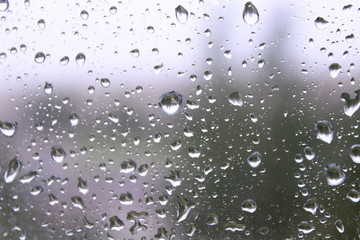 Wet glass after the rain. Raindrops on the windowpane. Close-up. Background. Texture.