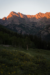 Sunset view of the Gore Range in Colorado near Piney Lake during summer. 