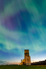 Aurora Borealis over a historic grain elevator in Pennant, Saskatchewan, Canada