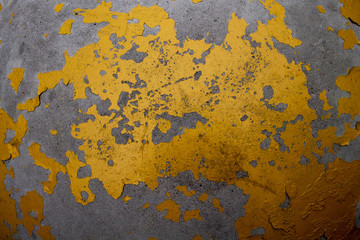 Old gold and silver grunge wall with peeling paint. Stained paint background
