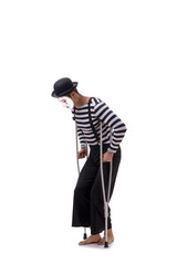 Mime with crutches isolated on white background