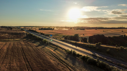 Fototapeta na wymiar aerial view of german autobahn and surrounding fields and meadows