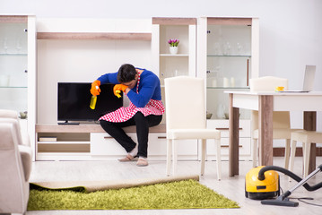 Contractor man cleaning house doing chores