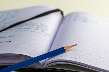 Open notebook with writing and a fountain pen