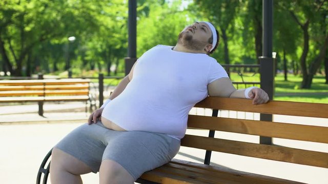 Obese man feels side aches after strenuous workouts outdoors, health problems