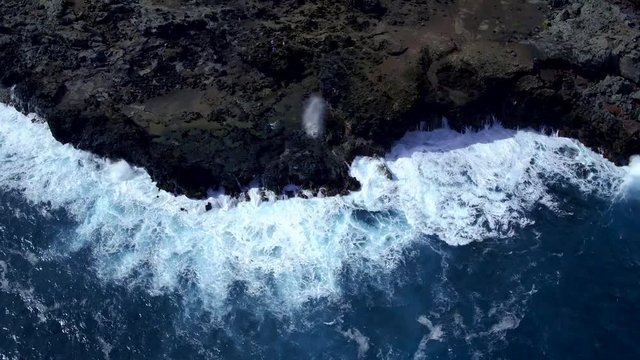 Nakalele Blowhole Maui Hawaii - Drone video of Makalele Blowhole Mahinanui in Maui Hawaii with crashing waves.  Beautiful high-resolution video of the Hawaiian Islands and water.