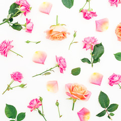 Floral pattern with roses flowers, petals and green leaves on white background. Flat lay, top view.