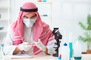 Arab doctor chemist studying new virus in lab