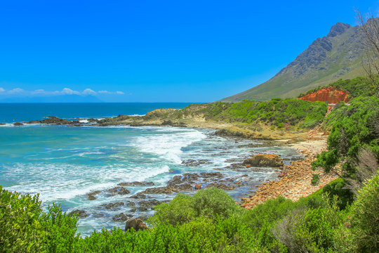 The Route 44 from Gordon s Bay to Rooi Els in False Bay, Western Cape, South Africa within Kogelberg Biosphere Reserve. The Clarence Drive is a popular road trip and scenic coastal mountain road.