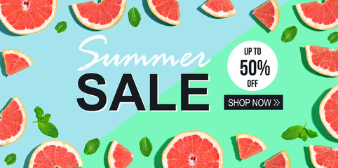 Summer sale message with halved fresh grapefruits
