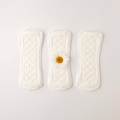 Menstrual Woman hygiene protection of sanitary pad on white background, woman menstruation cycle and critical day, menstruation frequency. Minimalist still life photography concept..