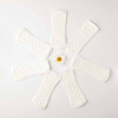 Menstrual Woman hygiene protection of sanitary pad on white background, woman menstruation cycle and critical day, menstruation frequency. Minimalist still life photography concept..