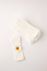 Menstrual Woman hygiene protection of sanitary pad on white background, woman menstruation cycle and critical day, menstruation frequency. Minimalist still life photography concept..