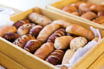 mix of breads in a wooden basket
