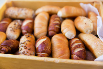 mix of breads in a wooden basket