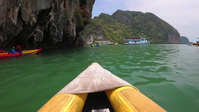 Kayaking beneath Limestone Cliffs in Phang Nga Province, Thailand