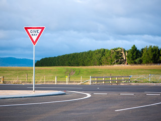 Give way sign on roadside of country highway. Tasmania, Australia.