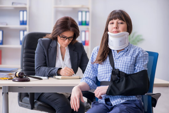 Injured employee visiting lawyer for advice on insurance