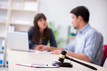 Female lawyer meeting with his male client in the office