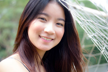 Naklejka premium Portrait of thai china adult beautiful girl relax and smile