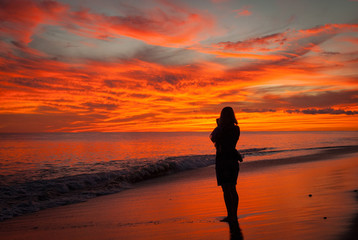 Fototapeta premium Vacationer photographs incredible Madaket sunset, Nantucket