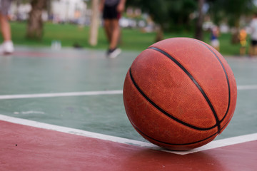 Basketball ball on corner of the outdoors court