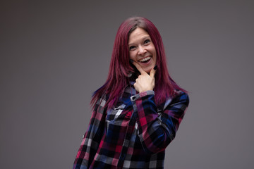 Fun playful attractive woman laughing at camera