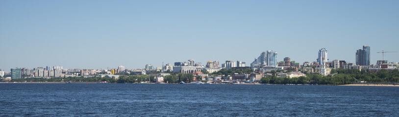 Fototapeta na wymiar Volga river embankment in Samara, Russia. Panoramic view of the city. On a Sunny summer day. 28 June 2018
