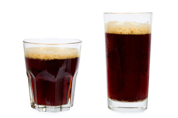 Cold glass of dark beer or kvass with foam isolated on white background.