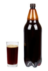 Dark brown plastic bottle of beer or kvass with glass cup isolated on a white background.