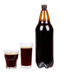 Dark brown plastic bottle of beer or kvass with glass cup isolated on a white background.