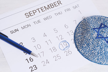 Calendar with kippah. Yom kippur concept.