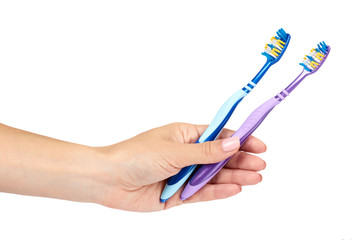 Color new toothbrush with hand isolated on a white background.