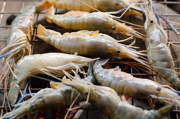 Shrimp is being grilled by the fireplace