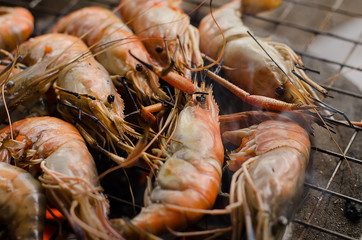 Shrimp is being grilled by the fireplace