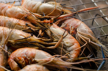 Shrimp is being grilled by the fireplace