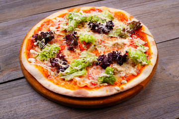 Vegetarian pizza with garlic sauce and lettuce, original chef's recipe, delicious mediterranean meals. Food delivery, restaurant, pizzeria menu concept