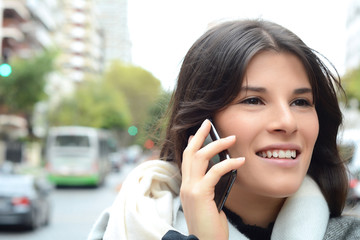 Young woman talking on her mobile phone.