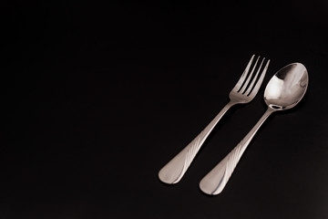 Fork and Spoon isolated on black background