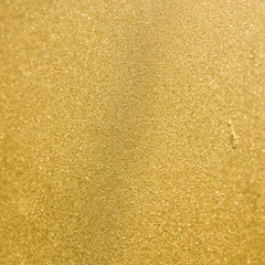 Shiny yellow leaf gold painted blur texture background