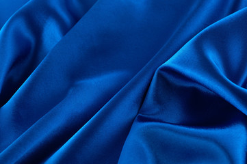 Abstract silk luxury background, piece of cloth, deep blue cloth texture