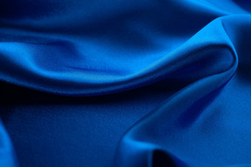 Abstract silk luxury background, piece of cloth, deep blue cloth texture