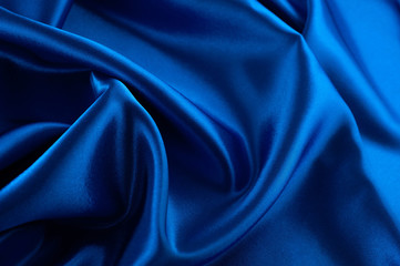 Abstract silk luxury background, piece of cloth, deep blue cloth texture