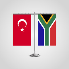 Table stand with flags of Turkey and South Africa.Two flag. Flag pole. Symbolizing the cooperation between the two countries. Table flags