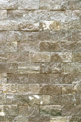 Decorative stone for decoration of the fireplace. Background. Vertical photo