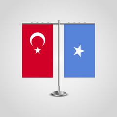 Table stand with flags of Turkey and Somalia.Two flag. Flag pole. Symbolizing the cooperation between the two countries. Table flags