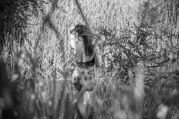 Mermaid. Beautiful lady at lace. Midsummer. Portrait of slavic or baltic woman in river near reeds. Summertime, ethnic  