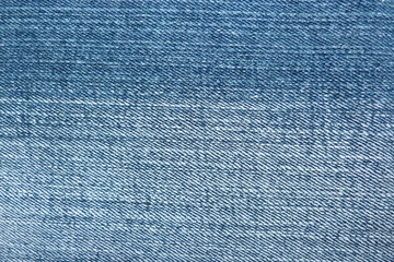 blue denim fabric close-up of gin natural material for clothing cotton rough linen background for decoration