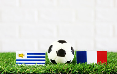 ball with Uruguay VS France flag match on Green grass football 2018