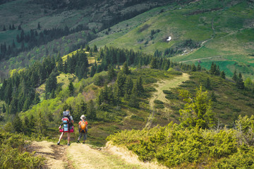 Fototapeta premium Hikers in a valley
